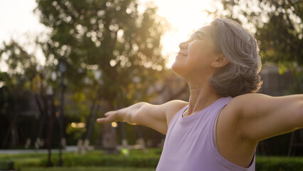 Asia adult aged people middle age mindful happy old woman open arm yoga deep calm stress relief...