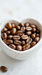 Heart-shaped arrangement of coffee beans on a light surface, symbolizing passion and love for coffee. Space for caption on the side adds room for text or promotional content.

