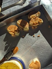 Freshly baked pukis, still warm from the mold, ready to be enjoyed from a street vendor's cart.