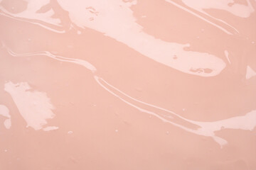 Fototapeta premium Pink lotion beauty skincare cream texture cosmetic product background