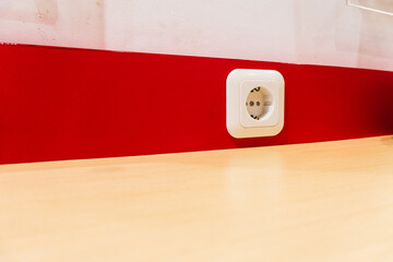 Electrical sockets are installed at each cafe table to facilitate customers.