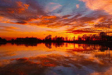 Spring sunset or sundowner view with reflections near Plattling, Isar, Deggendorf, Bavaria, Germany