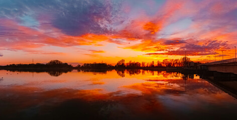 Spring sunset or sundowner view with reflections near Plattling, Isar, Deggendorf, Bavaria, Germany