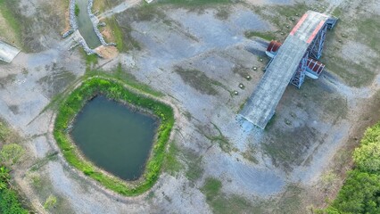 This aerial shot highlights the 4x4 ramp, showcasing its imposing structure and the rough...