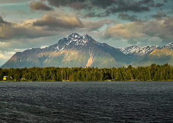 Light shining on mountain at Lake Lucille in Alaska