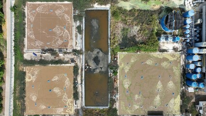 Drone captures a wastewater treatment site using aeration and sedimentation techniques to purify industrial effluent, emphasizing eco-conscious methods for pollutant reduction and water reclamation.
