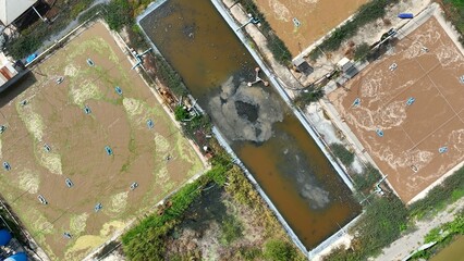 The layout shows a modular wastewater treatment design with parallel ponds and a central sludge...