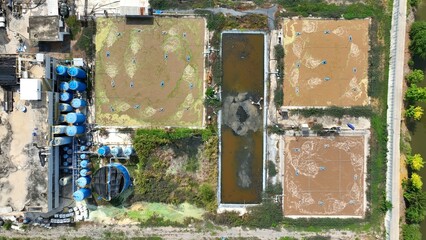 Overhead shot of a wastewater treatment plant using aeration ponds and biological processes to...