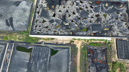 Contrasting ponds highlight the difference between degraded waste zones with chemical exposure and...