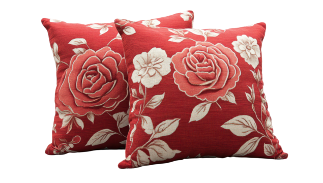 Pair of red square cushions featuring a floral pattern of roses and leaves in cream and coral tones