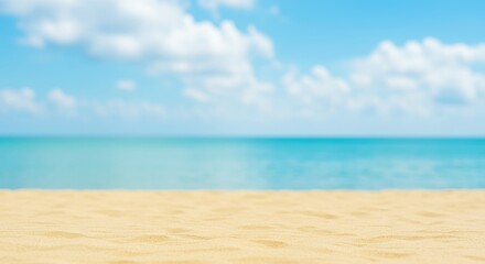 Obraz premium Beautiful beach with golden sand, clear turquoise water, and a vibrant blue sky with soft clouds