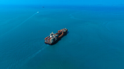 Aerial view of the freight shipping transport system cargo ship container. international...