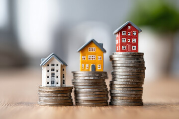 Loan and mortgage interest visual with apartment models symbolizing real estate finance and housing market insight