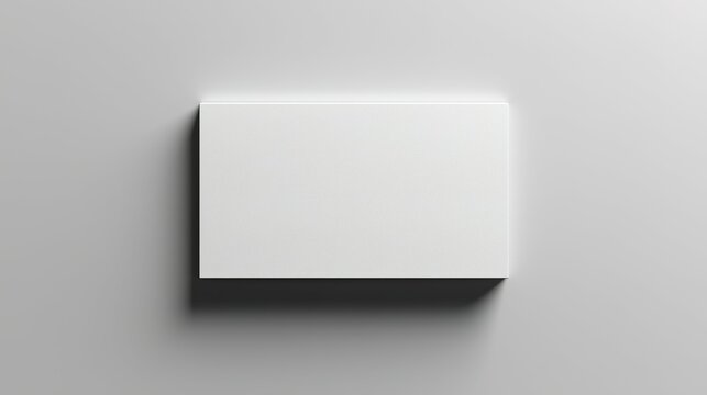 Blank white card on a flat surface, symbolizing simplicity and clarity in design.