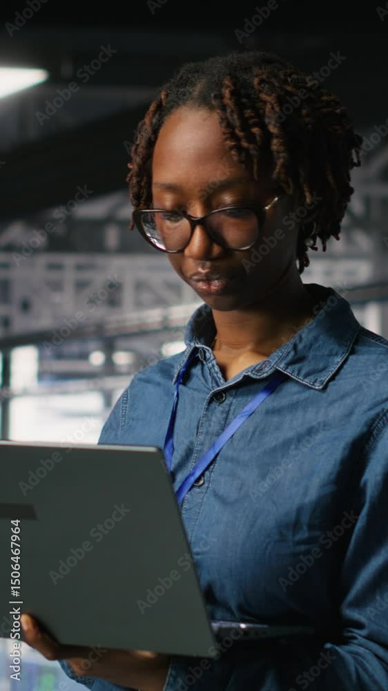 Poster vertical video portrait of joyful computer scientist in data center monitoring neural network llm vi