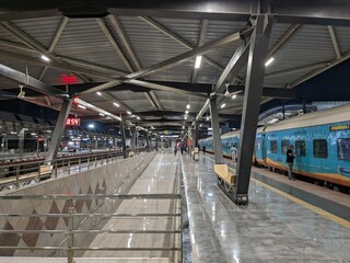 Modern Indian Railway Platform with Passengers at Night