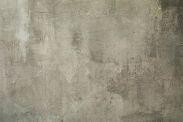 Decorative art background of shabby grey plastered wall with a olive tint, copy space.