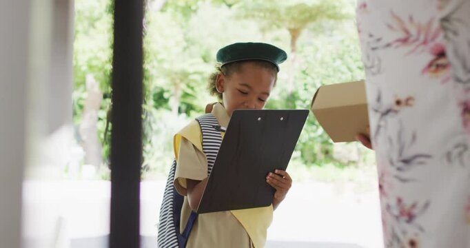 Animation of african american girl in scout costume delivering package to woman