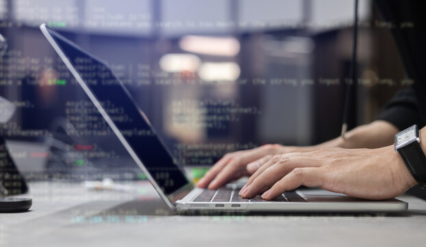 Engineer programmer employee type command laptop to input code language into software for build application or network system at office for business and network development technology concept