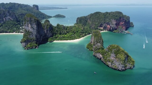 Aerial scene of green cliffs of Railay Beach Peninsula in Thailand with blue sky