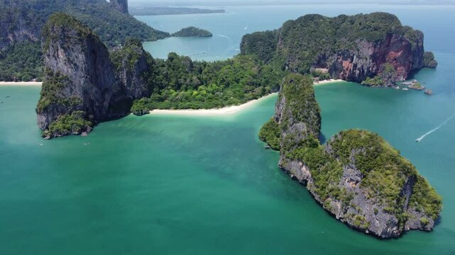 Aerial landscape view of green cliffs of Railay Beach Peninsula in Thailand with blue sky