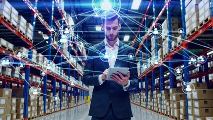 Warehouse Management & Digital Connectivity: A businessman expertly navigates the digital landscape within a warehouse, using a tablet to manage inventory and connect with a network of collaborators. - Powered by Adobe