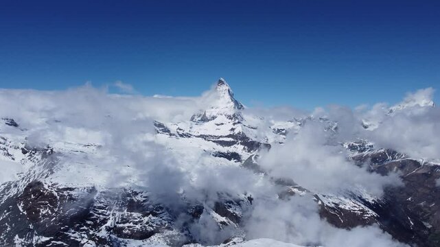 footage of the famous Matterhorn mountain in Zermatt, Switzerland. Aerial drone footage of the famous area in Zermatt traditional village and mountain in the Swiss alps in winter.
