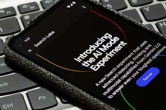 Portland, OR, USA - May 26, 2025: Introduction to the AI Mode experiment is seen in the Google app on the screen of a Google Pixel smartphone.