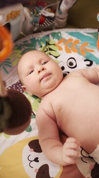Authentic close up footage of a cute  baby lying on the back in child crib