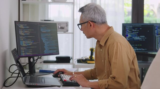 Group of asian senior in a collaborative software development analyzing  flowcharts  during a bootcamp training
