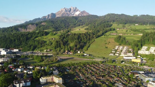 Aerial drone view of Lucerne cityscape, Lake Lucerne, and Swiss Alps mountains landscape, Switzerland