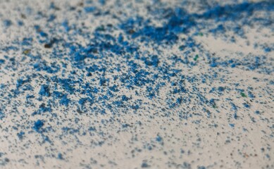 Abstract backdrop background white color canvas or paper sheet surface with tiny blue paint dots or scattered dust particles. Luxury or elegant monochrome texture composition.