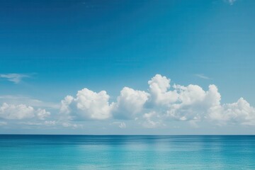 Obraz premium Ocean view with clouds against a blue sky today