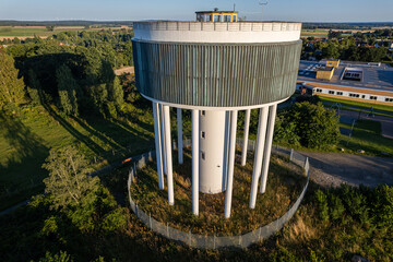 Water tower with columns and unique design, drone view