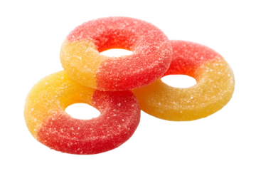 Three peach ring gummies isolated on transparent background