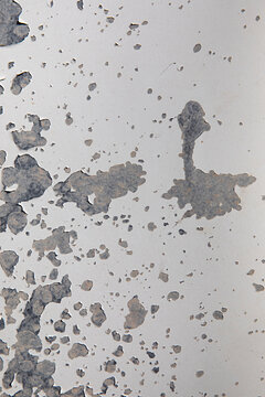 weathered white metal surface