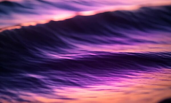 Gradient of rippled purple, pink, and orange texture