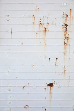 old white wall with rust textured background