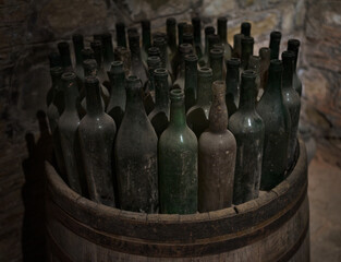 Old empty wine bottles in the wine cellar