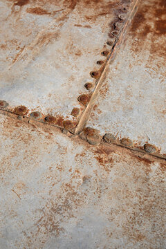 Rusty metal sheets with rivets for background textures
