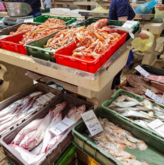 Fresh fish and seafood arranged on stands for sale at the fish market in Split, Croatia