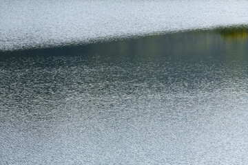 rippled surface of the calm lake