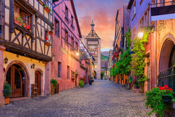 Riquewihr, France. Picturesque street with traditional half timbered houses on the Alsace Wine Route.