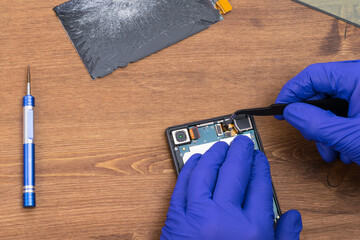 Using tweezers to repair and diagnose smartphone display