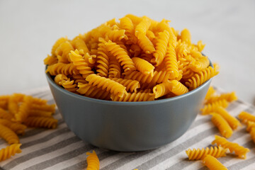 Dry Fusilli Pasta in a Bowl, low angle view.