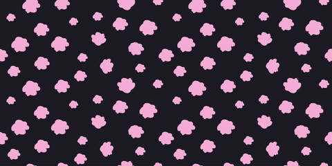 Playful seamless pattern with pink cloud shapes scattered on a black  background. Plain minimalist print for children's designs, bold wallpapers, stationery, and cheerful creative projects.