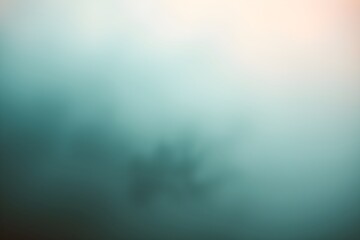 Blurred abstract image with soft gradients of teal and peach, creating a calm, ethereal atmosphere. Shapes suggest gentle movement or flow