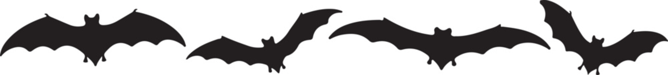 Mysterious Flight: A captivating silhouette of bats, captured mid-flight against a dark sky, embodies the spirit of Halloween. 