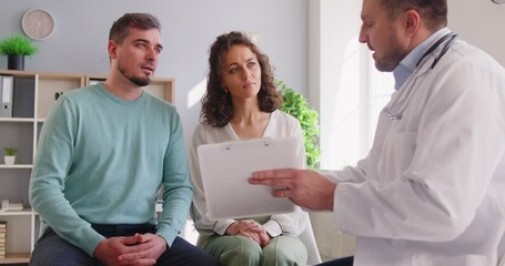 Young couple at reception with family therapist, doctor explaining health problems, family relationship married spouse consulting with male psychologist at therapy session, relationships problems - Powered by Adobe