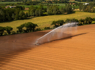 An aerial view of farmland being irrigated near Bures in Suffolk, UK
